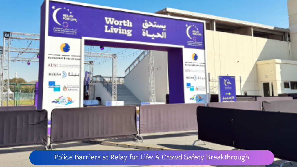 Police barriers ensuring crowd control and safety at Relay for Life event in Sharjah University