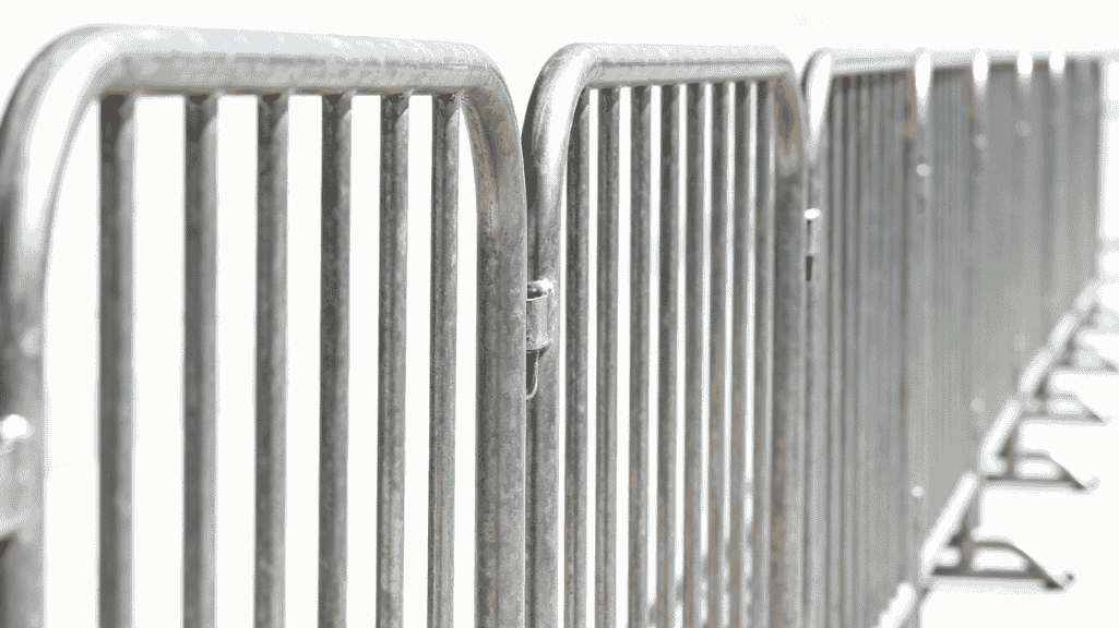 Steel crowd-control police barrier at a large outdoor event in UAE