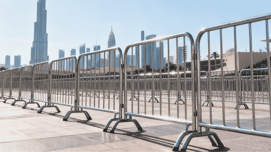 Police barriers deployed for crowd control at large event in Dubai showing strategic barrier placement and emergency access routes